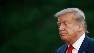 In this Saturday, May 30, 2020, photo, President Donald Trump walks across the South Lawn of the White House in Washington.