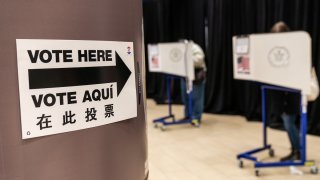 A sign reads "Voter Here" at an early voting polling location for the 2020 Presidential election