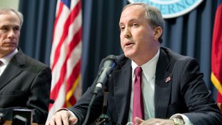 Texas Attorney General Ken Paxton holds a joint press conference Feb. 18, 2015 with Texas Gov. Greg Abbott, l, to address a Texas federal court's decision on the lawsuit filed by 26 states challenging President Obama's executive action on immigration. Paxton was indicted Aug. 3, 2015 on three counts of securities fraud not related to his official duties.