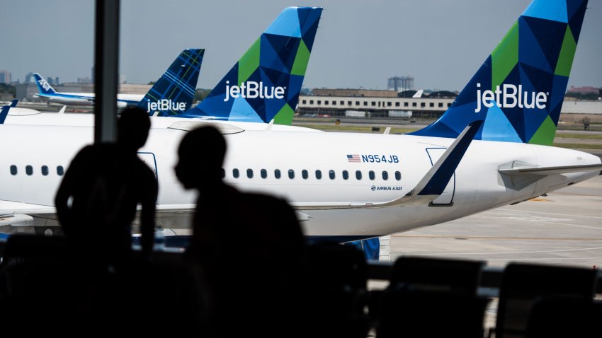 JetBlue planes at a gate at John F. Kennedy International Airport in New York.