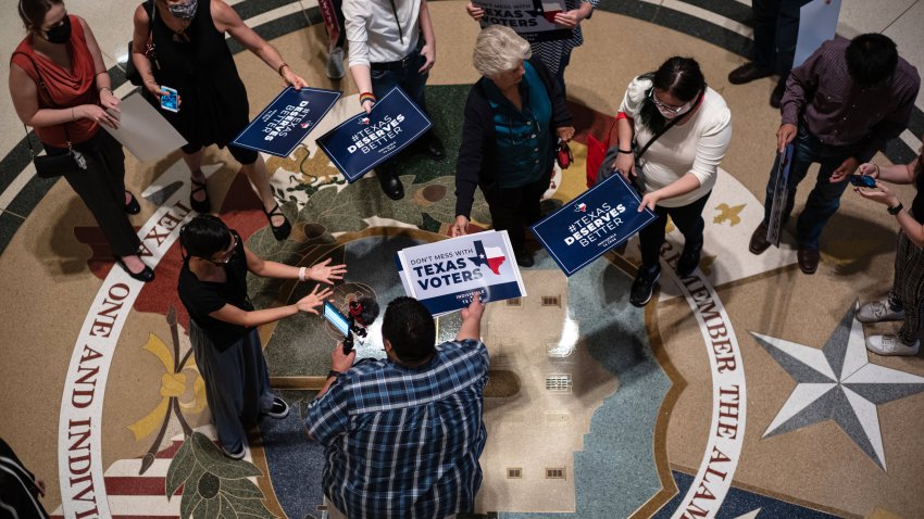 People opposed to the Texas Republican-led effort to pass new voting restrictions are gathered at the State Capitol as they wait to testify before state lawmakers who began committee hearings on election integrity bills on July 10, 2021 in Austin, Texas.