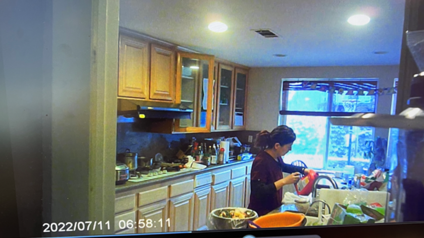 A screenshot from a video included in an Orange County Superior Court filing, allegedly showing Yue “Emily” Yu pouring drain cleaner into her husband’s drink.