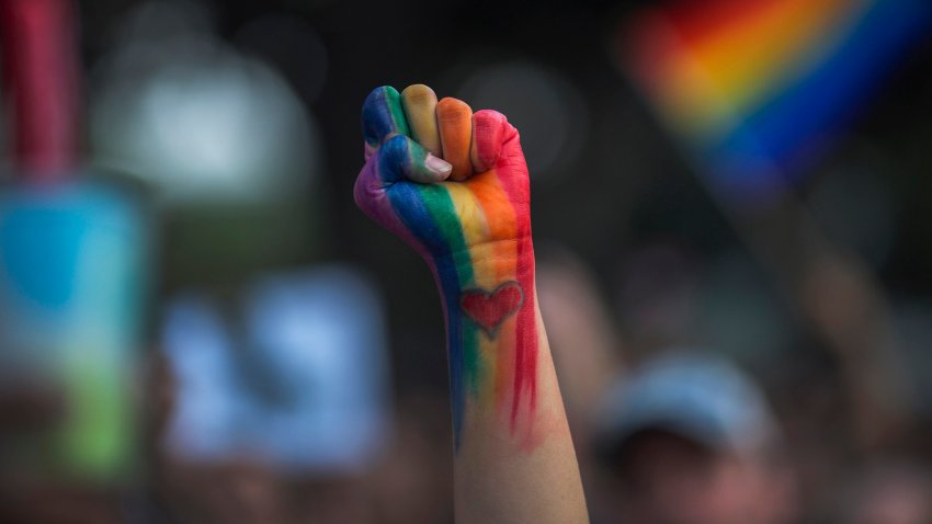 LOS ANGELES, CA – JUNE 13: A defiant fist is raised at a vigil for the worst mass shooing in United States history on June 13, 2016 in Los Angeles, United States. A gunman killed 49 people and wounded 53 others at a gay nightclub in Orlando, Florida early yesterday morning before suspect Omar Mateen also died on-scene.  (Photo by David McNew/Getty Images)