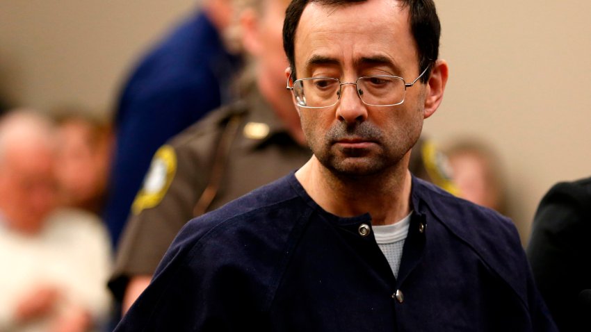 Former Michigan State University and USA Gymnastics doctor Larry Nassar addresses the court during the sentencing phase in Ingham County Circuit Court on January 24, 2018 in Lansing, Michigan.
Disgraced former USA Gymnastics doctor Larry Nassar was sentenced to 40 to 175 years in prison on Wednesday for sexually abusing scores of young girls under the guise of medical treatment. “I’ve just signed your death warrant,” Judge Rosemarie Aquilina said as she handed down the sentence after a week of gut-wrenching testimony by over 150 of Nassar’s victims.