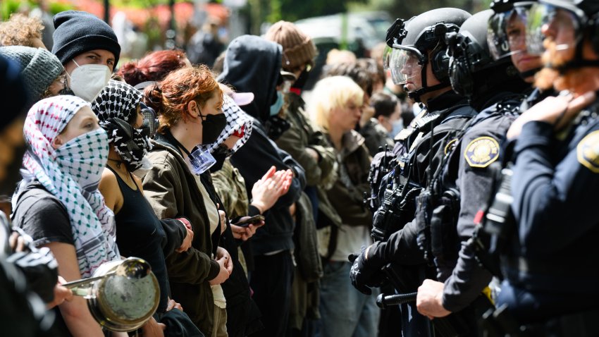 PORTLAND, OREGON – MAY 2: Police and pro-Palestine protesters stand-off in front of the barricaded Portland State University library on May 2, 2024 in Portland, Oregon. Pro-Palestinian encampments have sprung up at college campuses around the country with some protestors calling for schools to divest from Israeli interests amid the ongoing war in Gaza. (Photo by Mathieu Lewis-Rolland/Getty Images)