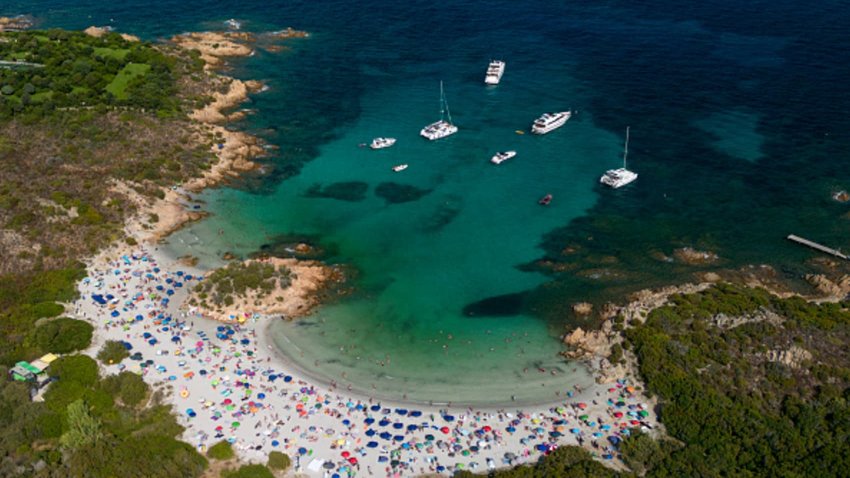 The beach is a popular destination in Sardinia. 