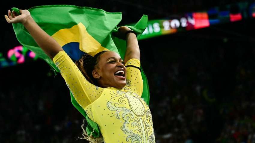 Second-placed Brazil’s Rebeca Andrade celebrates after the artistic gymnastics women’s all around final during the Paris 2024 Olympic Games at the Bercy Arena in Paris, on August 1, 2024. (Photo by Loic VENANCE / AFP) (Photo by LOIC VENANCE/AFP via Getty Images)