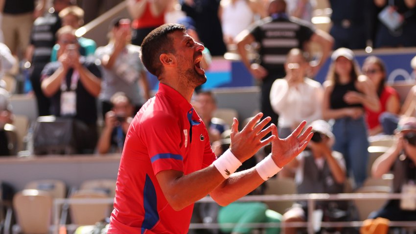 PARIS, FRANCE – AUGUST 04: Novak Djokovic of Team Serbia celebrates match point during the Men’s Singles Gold medal match against Carlos Alcaraz of Team Spain on day nine of the Olympic Games Paris 2024 at Roland Garros on August 04, 2024 in Paris, France. (Photo by Clive Brunskill/Getty Images)