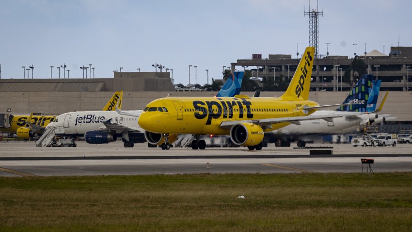 Spirit and JetBlue planes at Fort Lauderdale-Hollywood International Airport (FLL) in Fort Lauderdale, Florida, US, on Wednesday, Nov. 1, 2023. The US crackdown on airline consolidation faces a new test this week with the trial of a government lawsuit claiming the $3.8 billion takeover of Spirit Airlines Inc. by JetBlue Airways Corp. would reduce competition and boost fares for passengers. Photographer: Eva Marie Uzcategui/Bloomberg via Getty Images