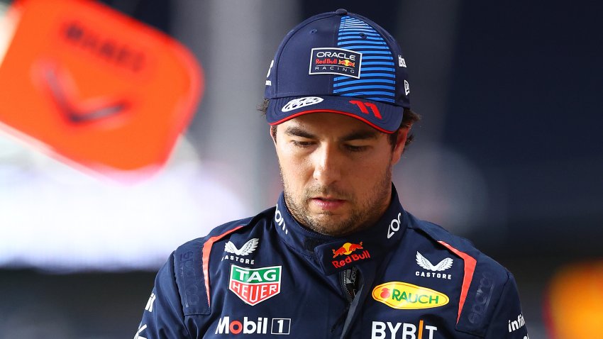 LUSAIL CITY, QATAR – NOVEMBER 29: 16th placed qualifier Sergio Perez of Mexico and Oracle Red Bull Racing walks in the Pitlane during Sprint Qualifying ahead of the F1 Grand Prix of Qatar at Lusail International Circuit on November 29, 2024 in Lusail City, Qatar. (Photo by Bryn Lennon – Formula 1/Formula 1 via Getty Images)