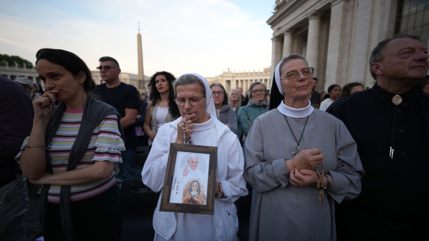 VATICAN CITY, VATICAN – APRIL 22: A nun holds a picture of Pope Francis as faithful gather for Rosary prayers in honour of Pope Francis at St Peter’s Square on April 22, 2025 in Vatican City, Vatican. The Vatican announced that Pope Francis died at 88, on Monday at 07:35 local time (05:35 GMT) and “the Bishop of Rome, Francis, returned to the home of the Father”. His death came after he appeared in St Peter’s Square on Easter Sunday, greeting thousands of worshippers. His funeral will be held on Satuday 26th April 2025. (Photo by Christopher Furlong/Getty Images)
