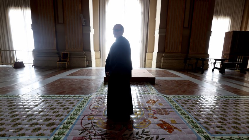 VATICAN CITY, VATICAN – APRIL 25: The Keeper of the Sistine Chapel crosses2 the central loggia where the new Pope will appear as Vatican prepares for funeral and conclave on April 25, 2025 in Vatican City, Vatican. Pope Francis, who died on April 21 aged 88, is lying in state for a final day ahead of tomorrow’s funeral in St. Peter’s Square. (Photo by Franco Origlia/Getty Images)