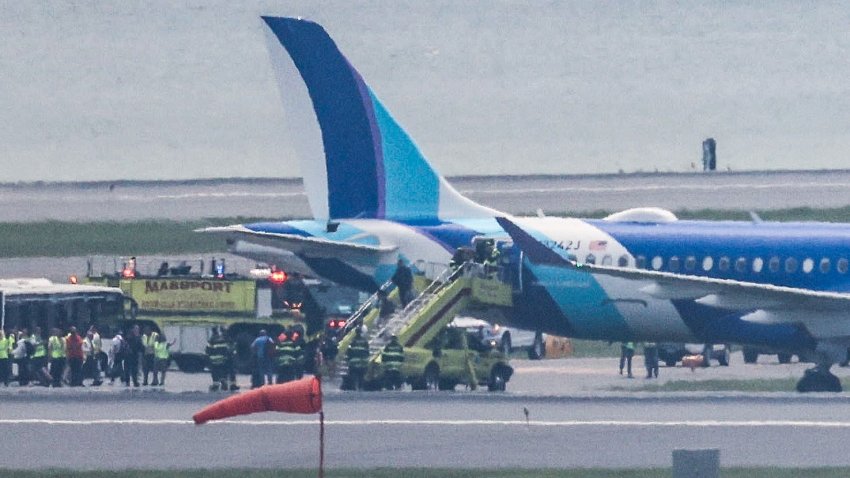 A JetBlue flight that rolled into grass next to the runway at Logan International Airport on June 12, 2025.