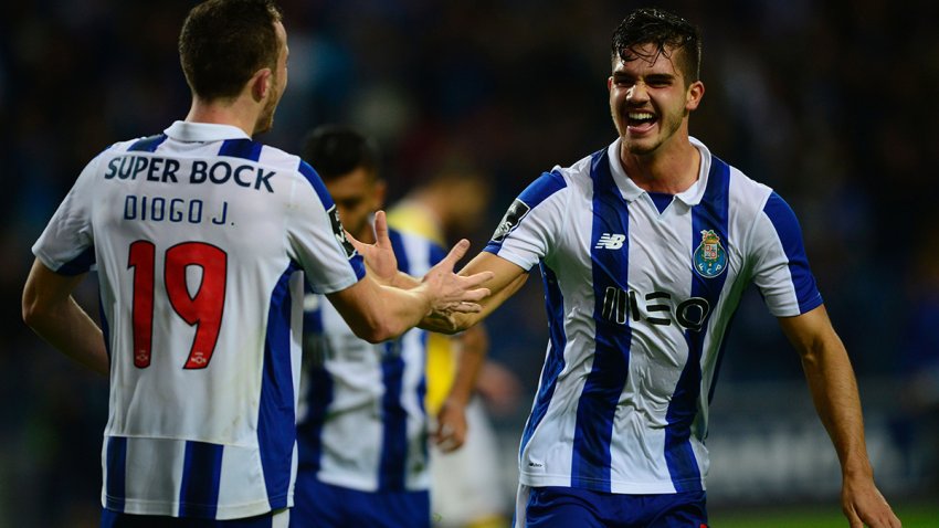Porto’s midfielder Andre Silva (R) celebrates with teammate forward Diogo Jota after scoring a goal during the Portuguese league football match FC Porto vs FC Arouca at the Dragao stadium in Porto on October 22, 2016. / AFP / MIGUEL RIOPA        (Photo credit should read MIGUEL RIOPA/AFP via Getty Images)