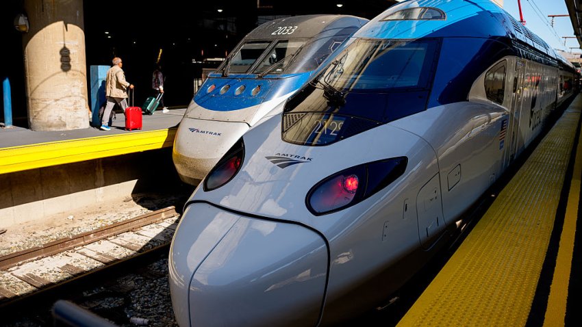 WASHINGTON, DC – AUGUST 27: A new NextGen Amtrak Acela train (R) is visible as passengers board an original model Regional Acela train (L) on August 27, 2025 in Washington, DC. Amtrak has launched its faster, upgraded NextGen Acela service along the Northeast Corridor as the Trump administration moves to take control of D.C.’s Union Station, citing a push to restore safety and revitalize the historic hub. (Photo by Andrew Harnik/Getty Images)