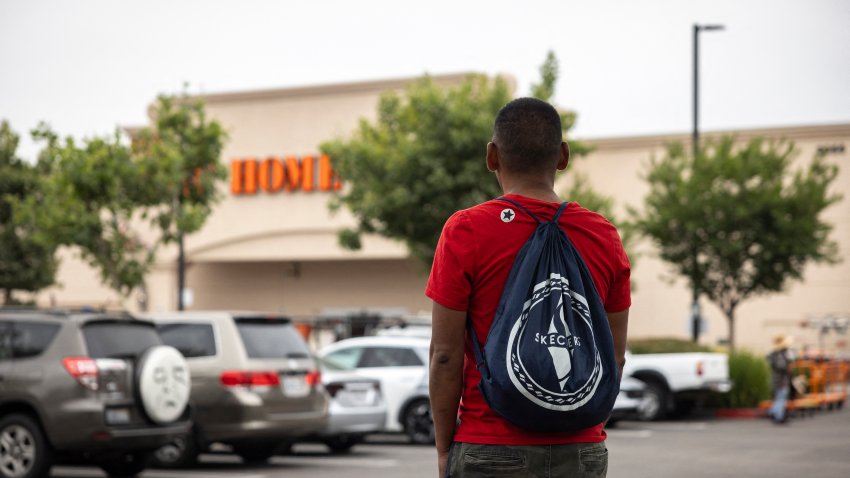 A day laborer waits on the parking lot of a Home Depot as federal immigration conducts raids in Los Angeles, California on June 20, 2025. Calm appeared to be returning to protest-hit Los Angeles on June 17 as the mayor lifted a nighttime curfew, while US President Donald Trump battled to keep control of California troops he deployed to the city. A fraction of the sprawling US city had been off-limits from 8pm to 6am to most people for a week after instances of looting and vandalism during demonstrations against Trump’s immigration raids. (Photo by ETIENNE LAURENT / AFP) (Photo by ETIENNE LAURENT/AFP via Getty Images)